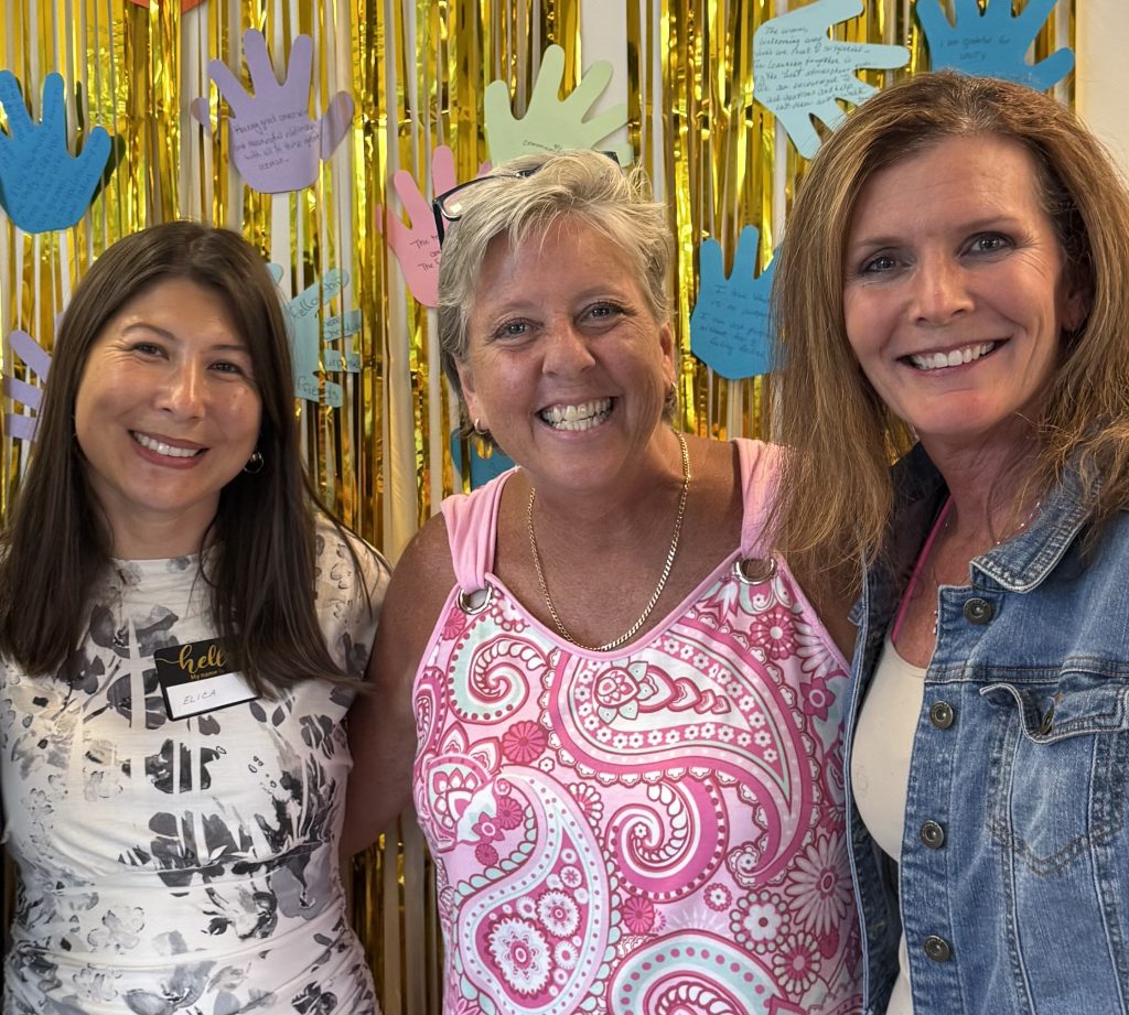 Three ladies smiling