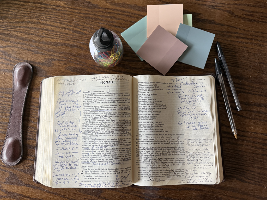Open wide-margin Bible filled with handwritten sermon notes, observations, underlining, and personal annotations.