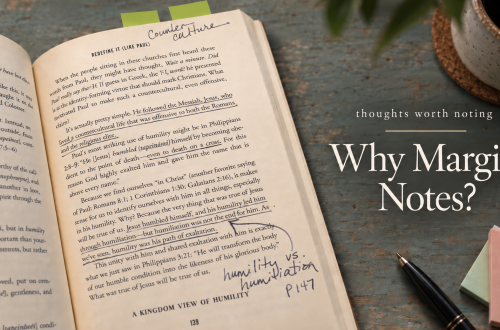 Open book with highlighted and underlined passages, handwritten notes, arrows, and annotations in the margins.